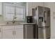 Stainless steel appliances and white cabinetry in kitchen at 5300 S Atlantic Ave # 9-507, New Smyrna Beach, FL 32169