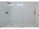 Large walk-in shower with marble tile and glass enclosure at 5300 S Atlantic Ave # 9-507, New Smyrna Beach, FL 32169