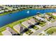 Aerial shot showcasing a lakeside community with homes surrounding a large pond with a fountain feature at 5340 Bear Corn Run, Port Orange, FL 32128