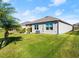 An expansive backyard featuring mature landscaping, enhancing privacy and a sense of tranquility at 5340 Bear Corn Run, Port Orange, FL 32128