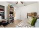 Bedroom featuring cozy bed, shelving and a doorway to a large walk-in closet at 5340 Bear Corn Run, Port Orange, FL 32128