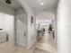 Spacious hallway leading to a dining area and laundry room at 5340 Bear Corn Run, Port Orange, FL 32128