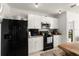 Modern kitchen features stainless steel appliances and ample cabinet space at 5340 Bear Corn Run, Port Orange, FL 32128