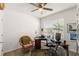 Bright office with a ceiling fan, large window, and functional desk space at 5340 Bear Corn Run, Port Orange, FL 32128