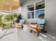 Stylish covered patio with comfortable Adirondack chairs, ideal for enjoying outdoor living at 5340 Bear Corn Run, Port Orange, FL 32128