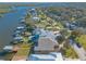 Aerial view of waterfront home with private dock and lush landscaping at 5727 Riverside Dr, Port Orange, FL 32127