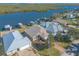 Waterfront property aerial view, showcasing house, dock, and landscaping at 5727 Riverside Dr, Port Orange, FL 32127