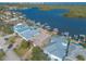 Aerial view of a waterfront home, showcasing its dock and yard at 5727 Riverside Dr, Port Orange, FL 32127