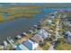 Waterfront home with private dock and beautiful landscaping, aerial view at 5727 Riverside Dr, Port Orange, FL 32127