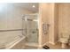 Clean bathroom with shower, tub, and updated fixtures at 5727 Riverside Dr, Port Orange, FL 32127