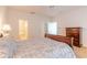 Comfortable bedroom with ensuite bathroom and ample closet space at 5727 Riverside Dr, Port Orange, FL 32127