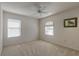 Spacious bedroom with neutral walls and ceiling fan at 5727 Riverside Dr, Port Orange, FL 32127