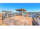 Private wooden boat dock with lift and water access at 5727 Riverside Dr, Port Orange, FL 32127