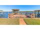 Spacious wooden dock offering covered boat storage and open space at 5727 Riverside Dr, Port Orange, FL 32127