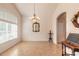 Spacious dining room with large windows and decorative chandelier at 5727 Riverside Dr, Port Orange, FL 32127