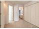 Hallway with access to bathroom and closets at 5727 Riverside Dr, Port Orange, FL 32127