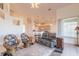 Living room with leather couches and wicker chairs at 5727 Riverside Dr, Port Orange, FL 32127