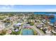 Aerial community view featuring tennis courts, landscaping, and nearby lake at 632 Sausalito Blvd, Casselberry, FL 32707