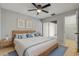 Primary bedroom featuring a neutral color palette, ceiling fan, and outdoor access at 632 Sausalito Blvd, Casselberry, FL 32707