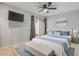 Bedroom with a ceiling fan, neutral tones, and a sliding door to the outside at 632 Sausalito Blvd, Casselberry, FL 32707