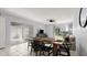 Bright dining area with tile flooring, modern lighting and a large table at 632 Sausalito Blvd, Casselberry, FL 32707