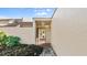 View of the front entryway showing a stone walkway leading to the glass-paneled front door at 632 Sausalito Blvd, Casselberry, FL 32707