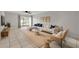 Bright living room with modern decor, plush seating, and a sliding door to the outdoors at 632 Sausalito Blvd, Casselberry, FL 32707