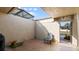 Enclosed patio featuring brick pavers, a single chair and views of the lawn beyond at 632 Sausalito Blvd, Casselberry, FL 32707