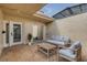 This charming brick patio features skylights and comfortable seating, perfect for relaxing or entertaining outdoors at 632 Sausalito Blvd, Casselberry, FL 32707