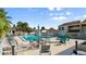 Community pool with lounge chairs, umbrellas and a nearby clubhouse at 632 Sausalito Blvd, Casselberry, FL 32707