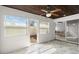 Bright sunroom with ceiling fan, tile floor, and sliding door access to the backyard at 632 Sausalito Blvd, Casselberry, FL 32707