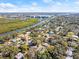 Wide aerial view showcasing property and waterway at 636 Faulkner St, New Smyrna Beach, FL 32168