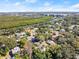 Aerial view of waterfront property, showcasing the home and surrounding neighborhood at 636 Faulkner St, New Smyrna Beach, FL 32168