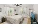 Spacious bedroom with a ceiling fan and neutral color palette at 636 Faulkner St, New Smyrna Beach, FL 32168