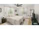 Spacious bedroom with a ceiling fan and neutral color palette at 636 Faulkner St, New Smyrna Beach, FL 32168