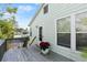 Wooden deck with poinsettia plants and a view of the house exterior at 636 Faulkner St, New Smyrna Beach, FL 32168