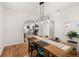 Charming dining room with wood table and hardwood floors at 636 Faulkner St, New Smyrna Beach, FL 32168