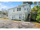 Two-story house with light green siding and deck at 636 Faulkner St, New Smyrna Beach, FL 32168