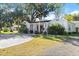 Newly renovated light blue house with a beautifully landscaped lawn at 636 Faulkner St, New Smyrna Beach, FL 32168