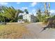 House exterior showcasing a light green color and a gravel driveway at 636 Faulkner St, New Smyrna Beach, FL 32168