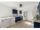 Modern kitchen with navy blue cabinets and stainless steel appliances at 636 Faulkner St, New Smyrna Beach, FL 32168