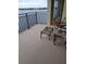 Relaxing balcony with wooden chairs and waterfront view at 654 Marina Point Dr # 654, Daytona Beach, FL 32114