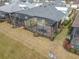 Backyard aerial view showing a screened patio and grassy area at 667 Margaritaville Ave, Daytona Beach, FL 32124