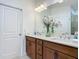 Double vanity bathroom with a large mirror at 667 Margaritaville Ave, Daytona Beach, FL 32124