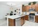 Island kitchen features stainless steel appliances and breakfast bar at 667 Margaritaville Ave, Daytona Beach, FL 32124