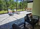 Relaxing screened patio with outdoor furniture at 667 Margaritaville Ave, Daytona Beach, FL 32124