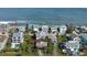 Aerial view of beach house community, showing home's location and proximity to the ocean at 6911 Turtlemound Rd, New Smyrna Beach, FL 32169