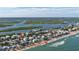 Aerial showcasing home's beach and waterway proximity at 6911 Turtlemound Rd, New Smyrna Beach, FL 32169