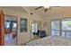 Bedroom with sliding glass doors and ocean view at 6911 Turtlemound Rd, New Smyrna Beach, FL 32169