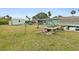 Large backyard with shed and gardening area at 705 Wayne Ave, New Smyrna Beach, FL 32168